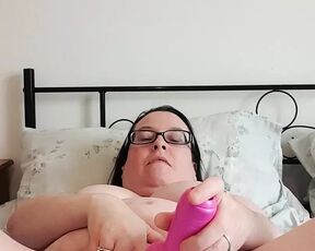 MILF playing with pink vibrator spreading her pussy lips